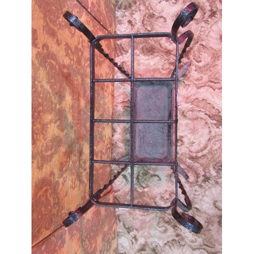 1237 - An iron work umbrella/stick stand with eight divisions on scrolled supports