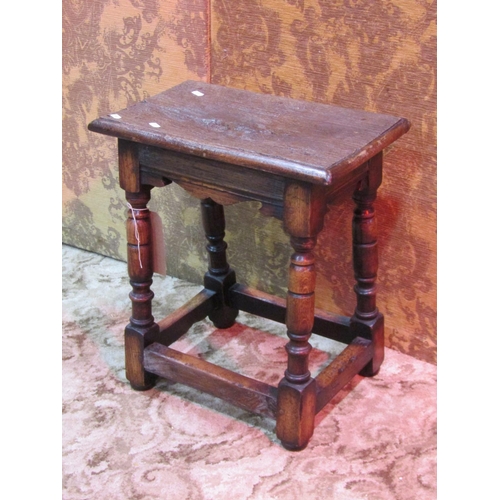 1261 - An old English oak joint stool raised on turned baluster supports united by stretchers, 51cm high x ... 