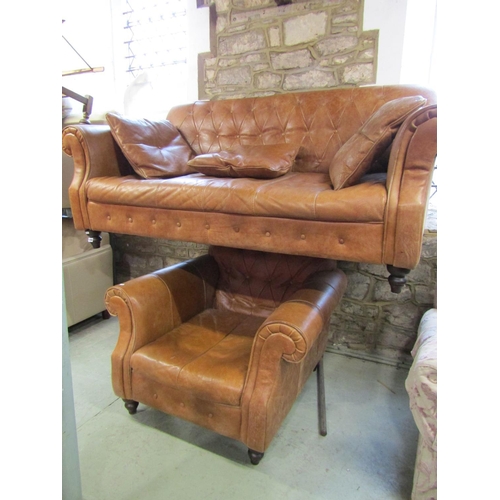 1298 - A good quality contemporary but traditional style tan leather sofa with buttoned back and rolled arm... 