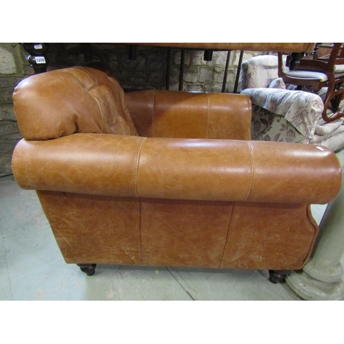 1298 - A good quality contemporary but traditional style tan leather sofa with buttoned back and rolled arm... 