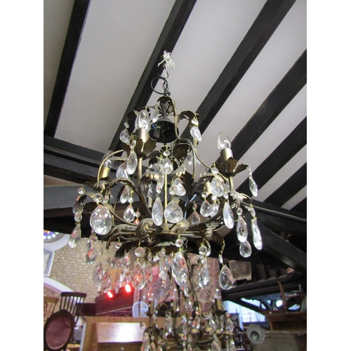 1328 - A pair of decorative five branch chandeliers with prism tear shaped droplets and leaf detail, approx... 