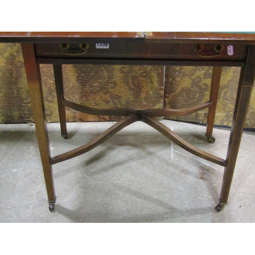 1336 - An inlaid Edwardian mahogany fold over card table with frieze drawer raised on square tapered legs, ... 