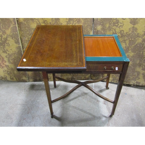 1336 - An inlaid Edwardian mahogany fold over card table with frieze drawer raised on square tapered legs, ... 