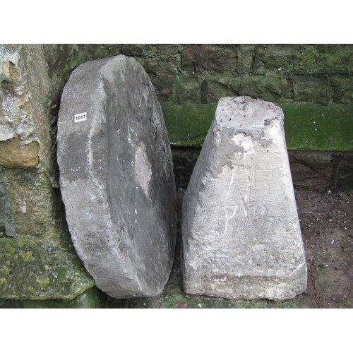 1017 - A carved natural stone staddle stone base of square tapered form with later associated circular mill... 