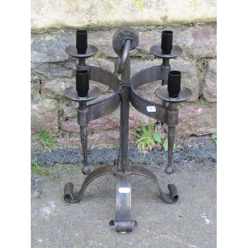 1032 - An ironwork floorstanding three branch candelabra with open scroll detail, 120 cm high, together wit... 