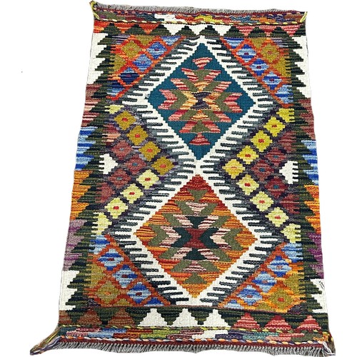 1638 - A Chobi kilim mat with two central diamonds, 91cm x 60cm approximately