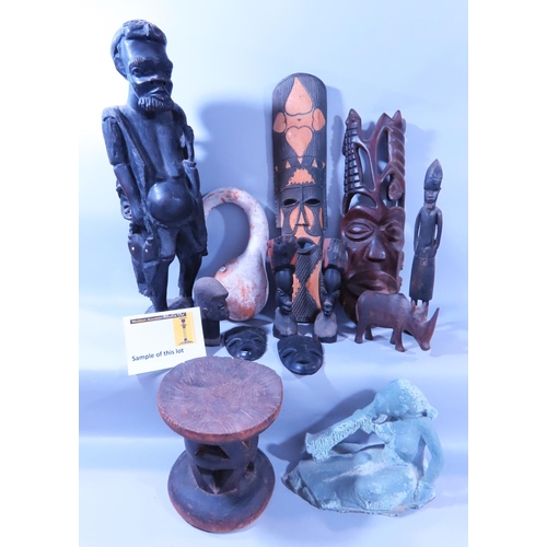 585 - African Souvenirs - mixed selection including carved figures, masks, a head rest, a gourds, an unfin... 