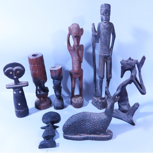 585 - African Souvenirs - mixed selection including carved figures, masks, a head rest, a gourds, an unfin... 