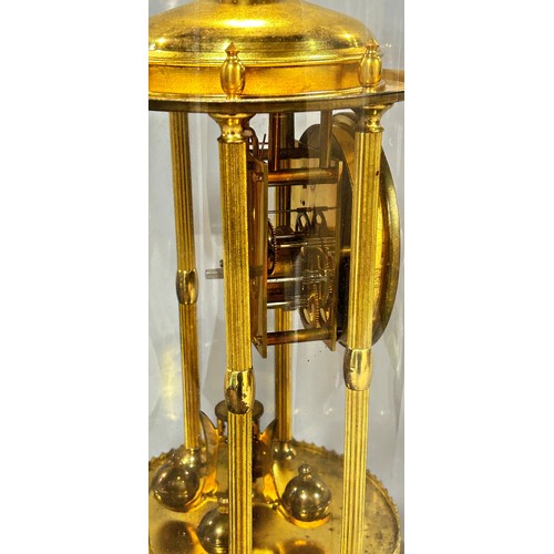 439 - A large brass anniversary clock, beneath a large glass dome, 39cm high.