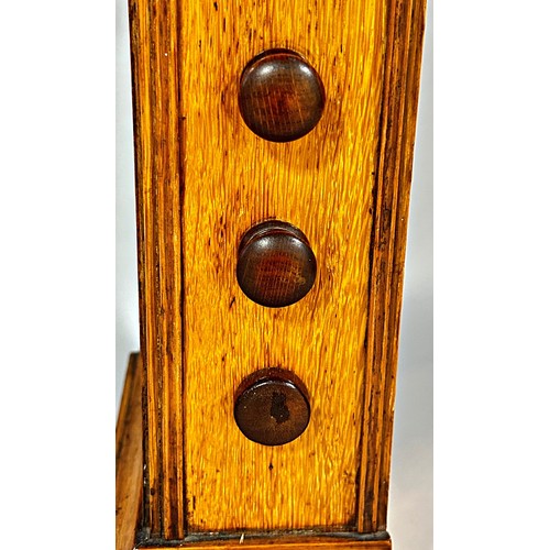 440 - A late Victorian / Edwardian oak cased table clock/calendar, 3.5” dial, 34cm high.