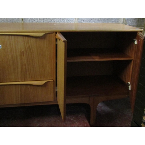 1520 - A mid 20th century ‘S Form’ teak sideboard, fitted with an arrangement of drawers and cupboards, 78c... 