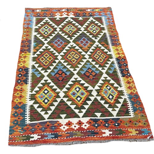 1653 - A Maimana kilim with overall field of green stepped and straight diamonds 180cm x 112cm approximatel... 