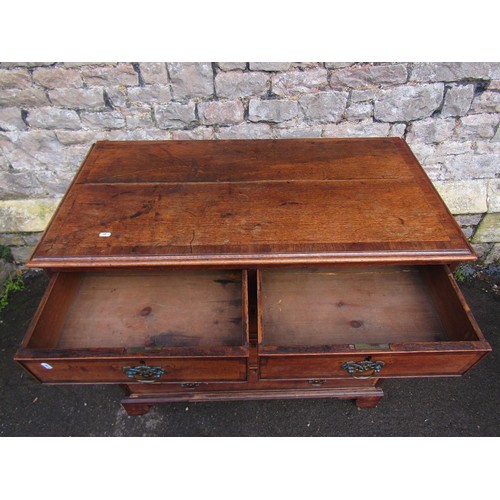 1466A - A Georgian oak chest of three long and two short drawers with cross banded detail, raised on bracket... 