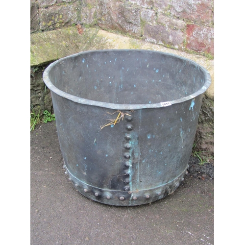 1041 - An antique patinated copper cauldron/log bin with flared rim and pop rivetted seams, 47cm high x 63c... 