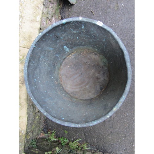 1041 - An antique patinated copper cauldron/log bin with flared rim and pop rivetted seams, 47cm high x 63c... 