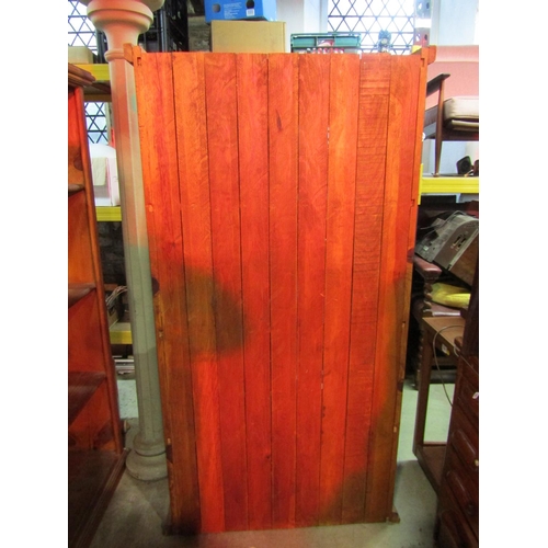 1166 - A Mexican pine floorstanding side cabinet enclosed by a pair of full length rectangular glazed panel... 