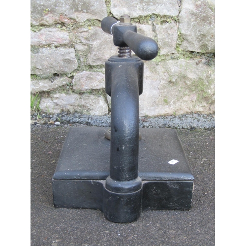 1374 - An antique cast iron book press with club handle and central screw thread, 34cm high (closed) x 42cm... 