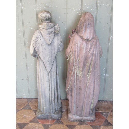 1049 - Two weathered (one painted) cast composition stone garden ornaments in the form of monks, 75 cm high