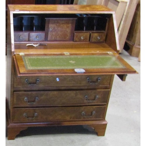 1188 - A reproduction walnut veneered bureau in the Georgian style