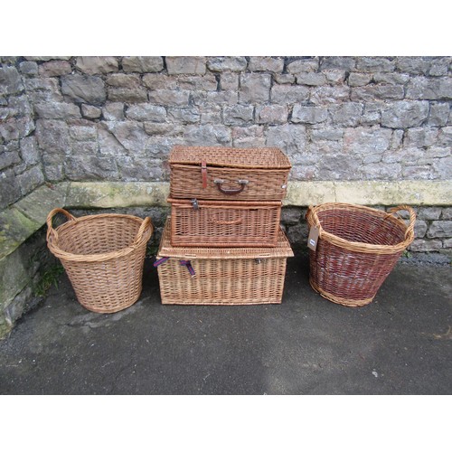 1075 - A Fortnum & Mason picnic basket together with two others and two further wicker two handled log bask... 