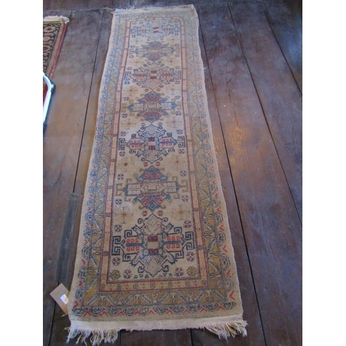 1625 - An eastern wool rug with beige ground, seven medallion centre within simple running borders, 280cm x... 