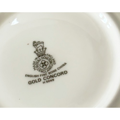 3 - A collection of Royal Doulton Gold Concord pattern porcelain dinner wares comprising eight dinner, s... 