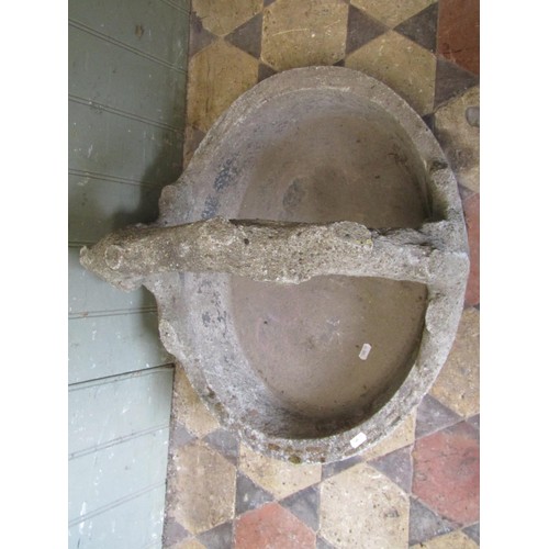 1012 - A novelty weathered cast composition stone planter in the form of an oval basket with rustic handle,... 