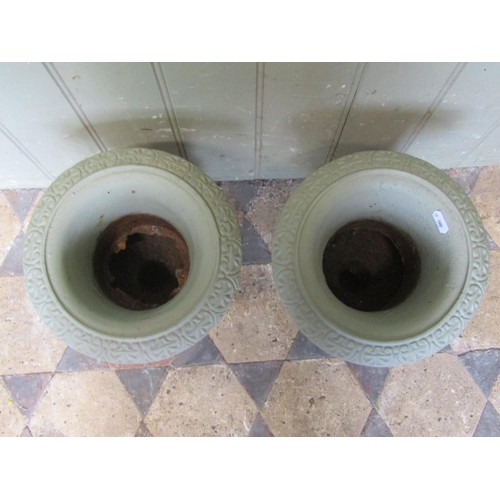 1014 - A pair of light green painted campana shape cast iron urns with flared rims, 34 cm high x 24 cm