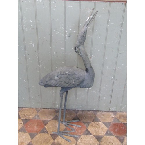 1025 - A heavy gauge cast metal garden ornament in the form of a stork, 95 cm high