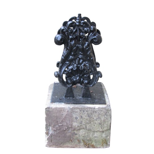 1026 - A cast iron black painted boot scraper with scrolled acanthus and shell detail set on a rectangular ... 