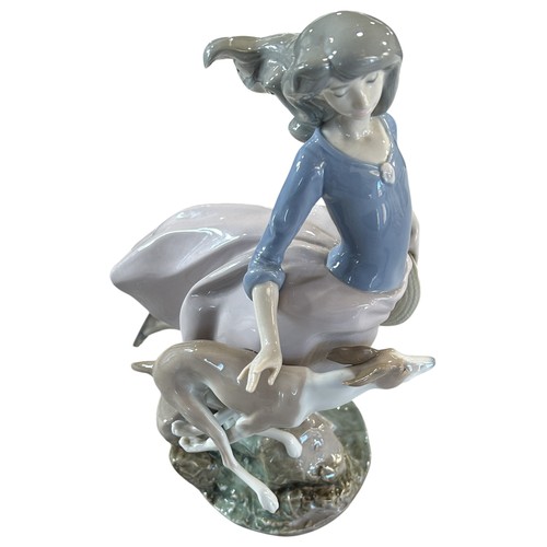 83 - A Lladro figure 5855 - Afternoon Jaunt, 27cm