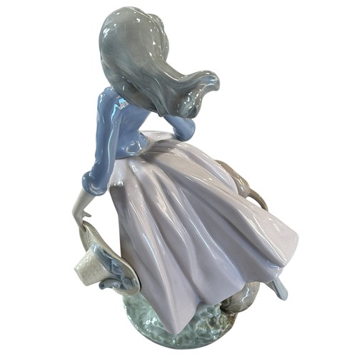 83 - A Lladro figure 5855 - Afternoon Jaunt, 27cm