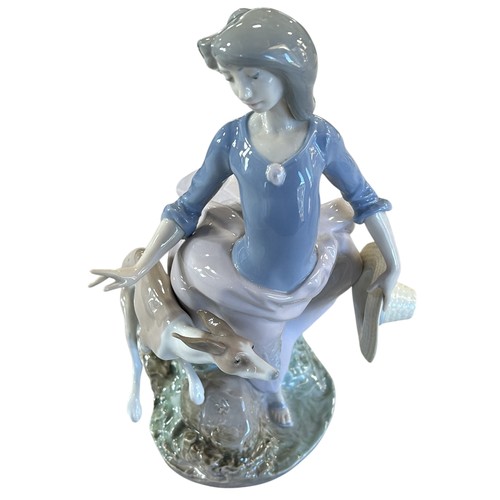 83 - A Lladro figure 5855 - Afternoon Jaunt, 27cm