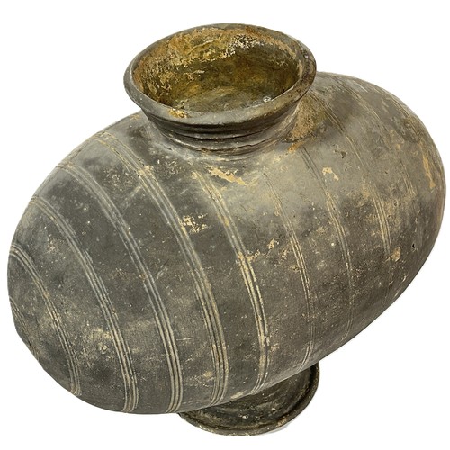 68 - A Chinese Han dynasty style cocoon pottery wine vessel with banded detail 35cm high.