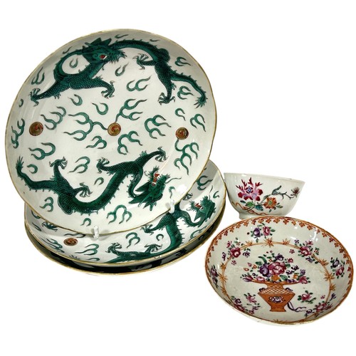 72 - Three 19th century Chinese Famille Verte porcelain dragon plates and a Famille Rose tea bowl and sau... 