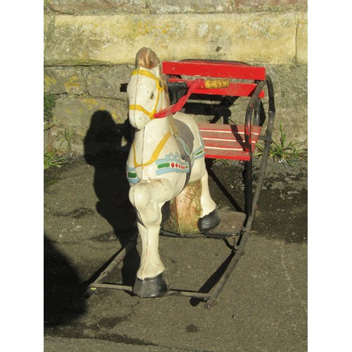 1060 - A Vintage Pedigree soft toy push-along dog, together with two rocking horses (af) (3)