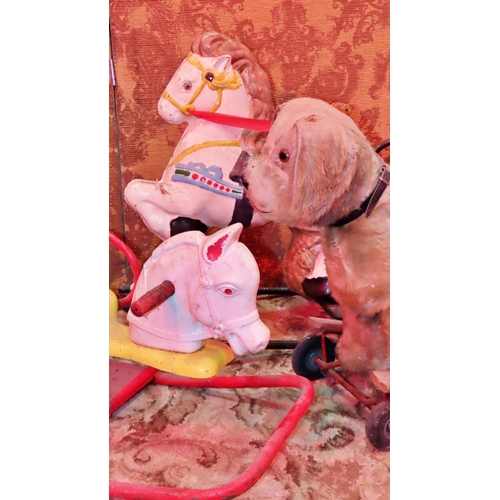 1060 - A Vintage Pedigree soft toy push-along dog, together with two rocking horses (af) (3)