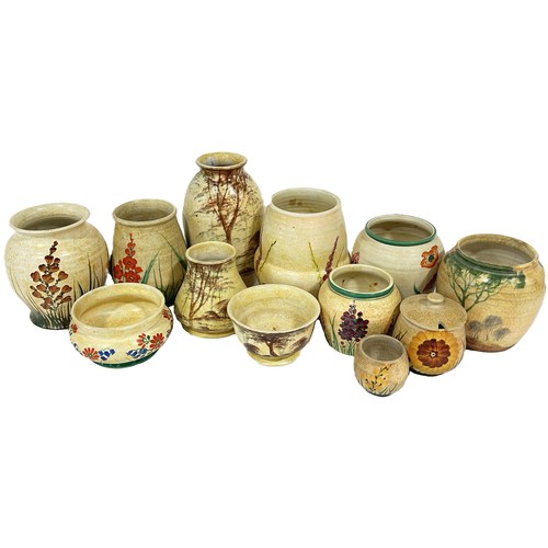 64 - A group of Radford pottery, decorated throughout with floral motifs, to include jugs, vases etc, (23... 