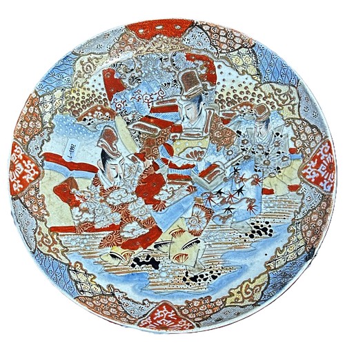 77 - A Japanese Satsuma export earthenware dish decorated with warrior and landscape detail, together wit... 