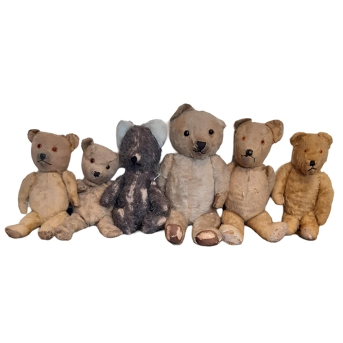 765 - A collection of 12 unsorted vintage teddy bears all playworn and most in need of restoration. Height... 