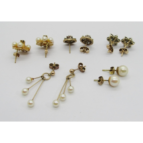 334 - Five pairs of 9ct earrings; two pairs of gem and diamond cluster studs, together with three pairs se... 