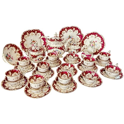 8 - A 19th century Rockingham style porcelain tea service with hand painted floral bouquets within plum ... 