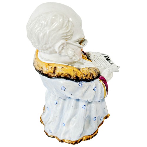 21 - A 19th century continental novelty figurative porcelain tobacco jar in the form of a robed character... 