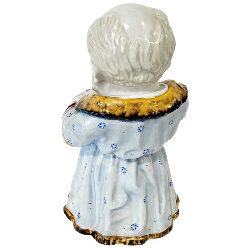 21 - A 19th century continental novelty figurative porcelain tobacco jar in the form of a robed character... 