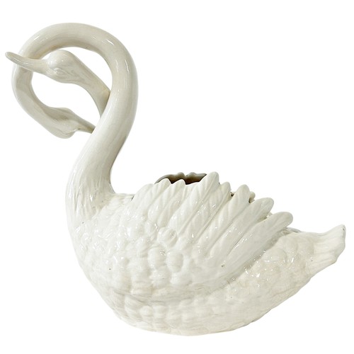 22 - An Italian pottery jardiniere in the form of entwined swans on an associated base, 33cm high