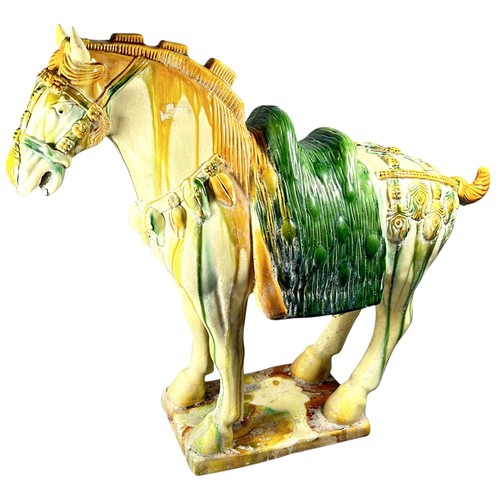 82 - A large Chinese earthenware Tang style horse decorated in sancai glazed finish (af)