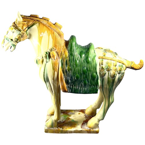 82 - A large Chinese earthenware Tang style horse decorated in sancai glazed finish (af)