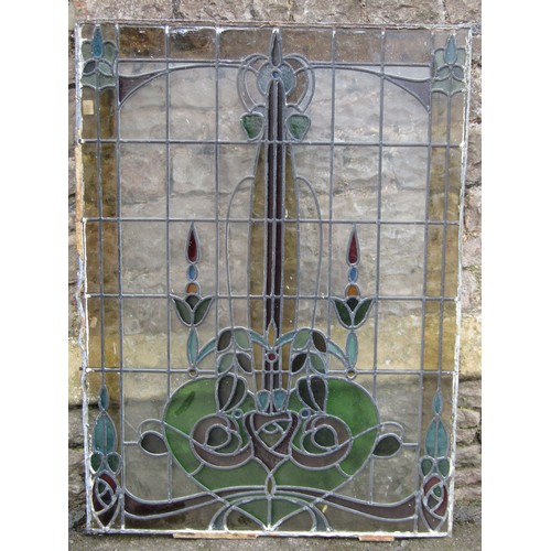 1041 - A collection of leaded and stained glass window panels with varying foliate design, (varying size, s... 