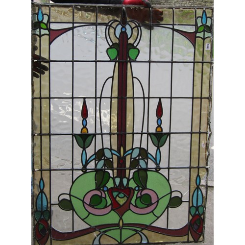 1041 - A collection of leaded and stained glass window panels with varying foliate design, (varying size, s... 