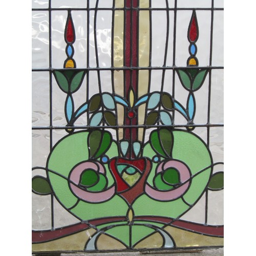 1041 - A collection of leaded and stained glass window panels with varying foliate design, (varying size, s... 